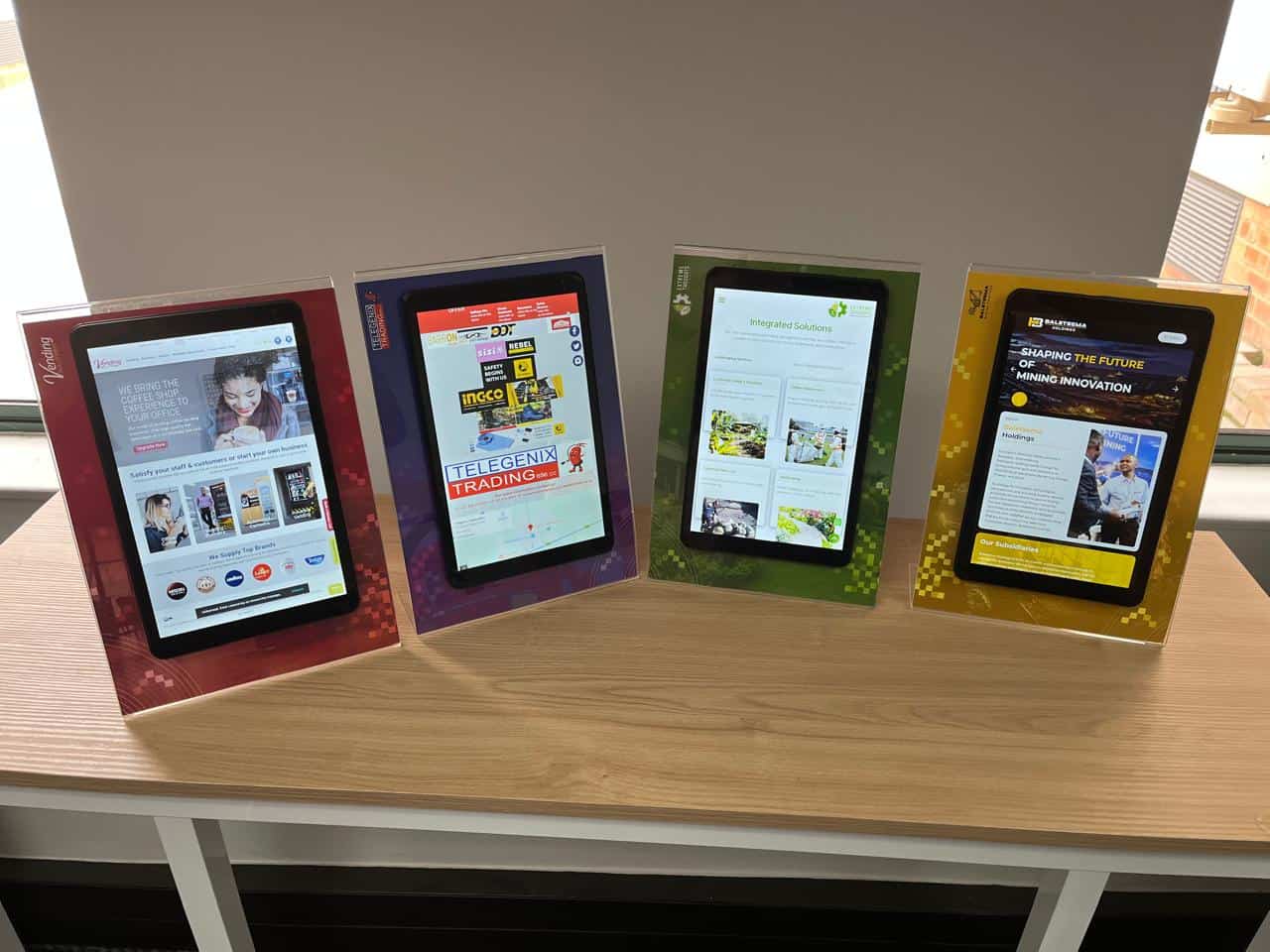 Perspex display stand, with backing board and android tablet to serve as countertop display